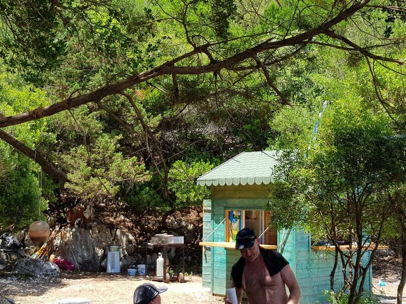Small beach BBQ hut under the trees at Koutsoupia